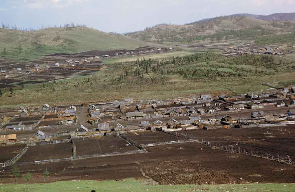 Ploughed fields in an unknown village.