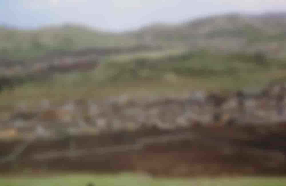 Ploughed fields in an unknown village.