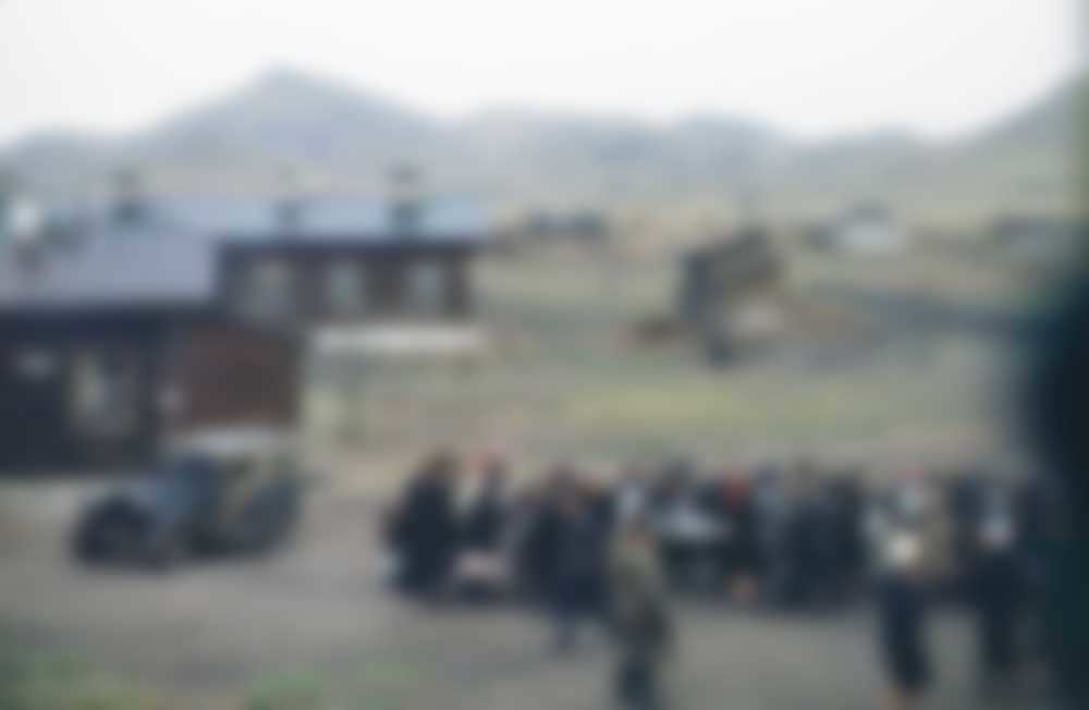 A GAZ 4x4 and a communal table, location unknown.