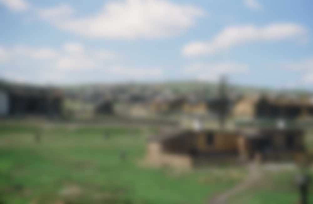 Children and green spaces in an unknown village.